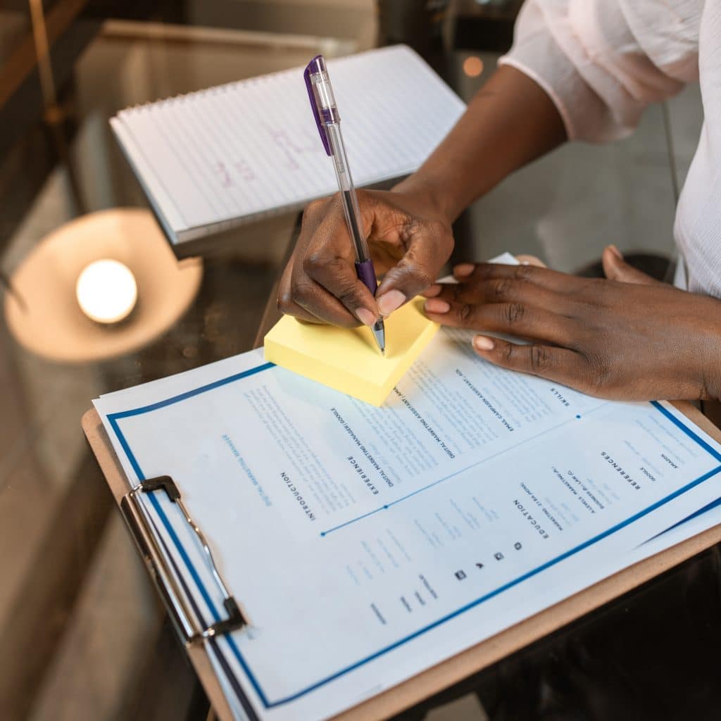 Business paperwork at a table, illustrating TM Financial Services business planning